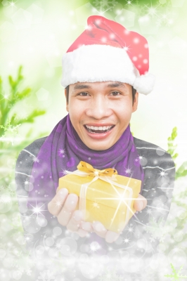 A man holding a Christmas gift